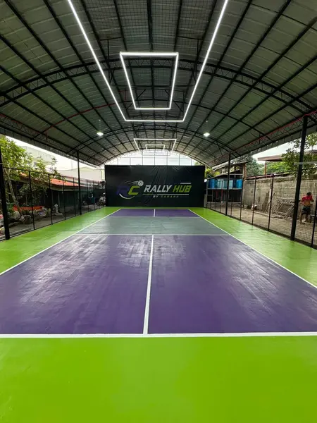 Portrait view of the RC Rally Hub court and branded backdrop banner